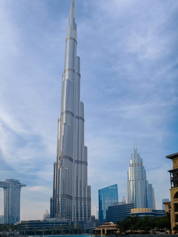 dubai-united-arab-emirates-february-10-2021-bottomup-view-burj-khalifa-contrast-with-blue-sky-clouds_135932-11643